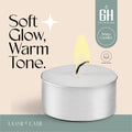 White candle with a lit wick on a beige background, featuring text about soft glow and warm tone.